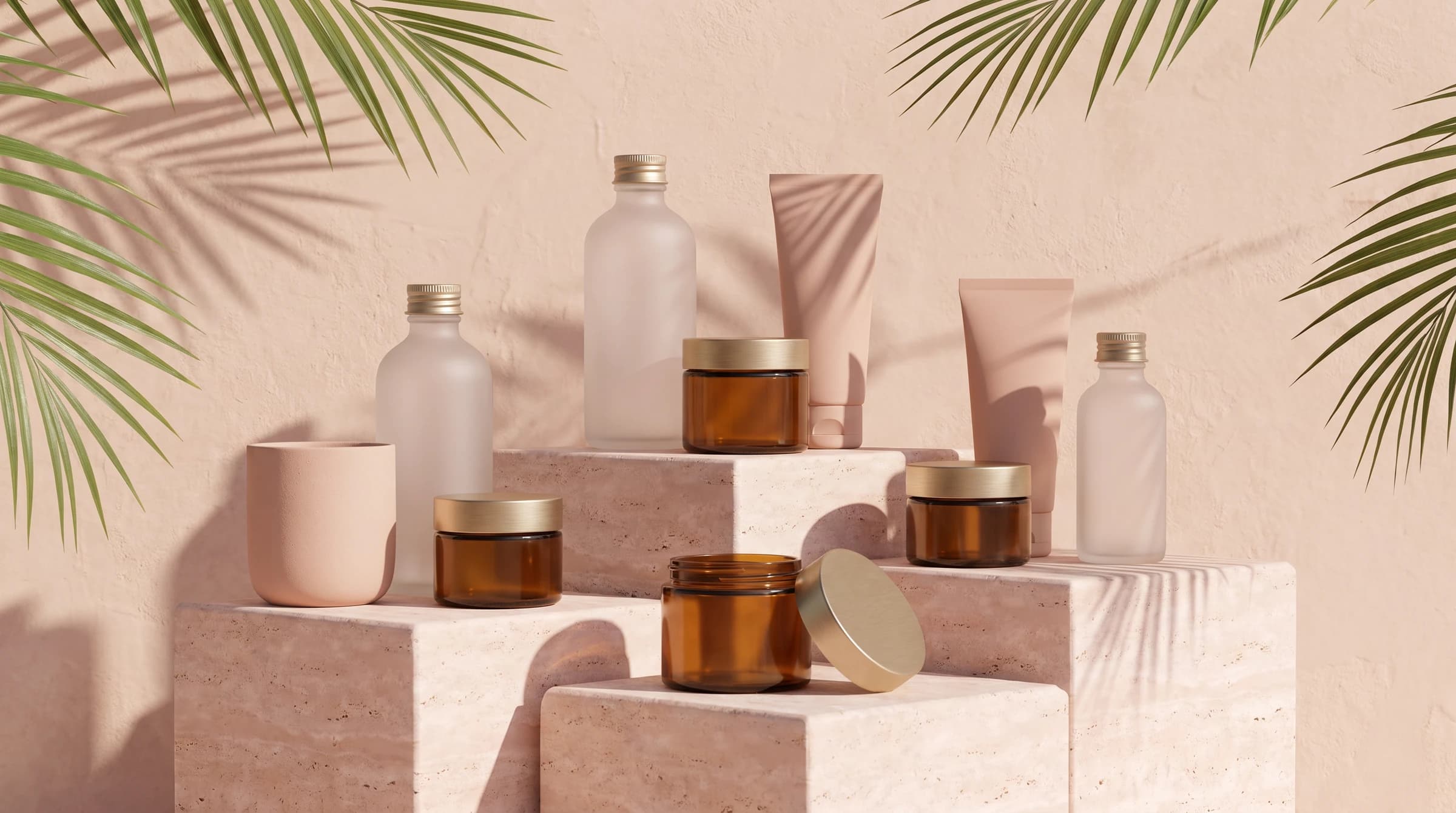 Unbranded bottles and jars arranged on pink travertine plinths in sunlight